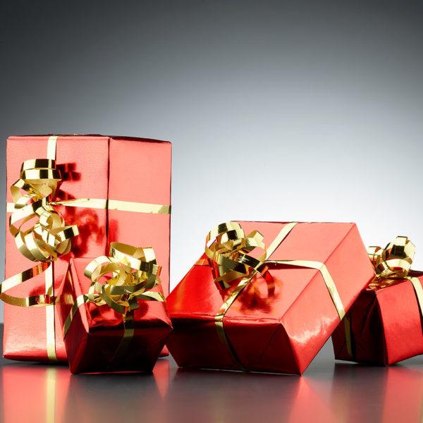 presents wrapped in red paper and gold ribbon